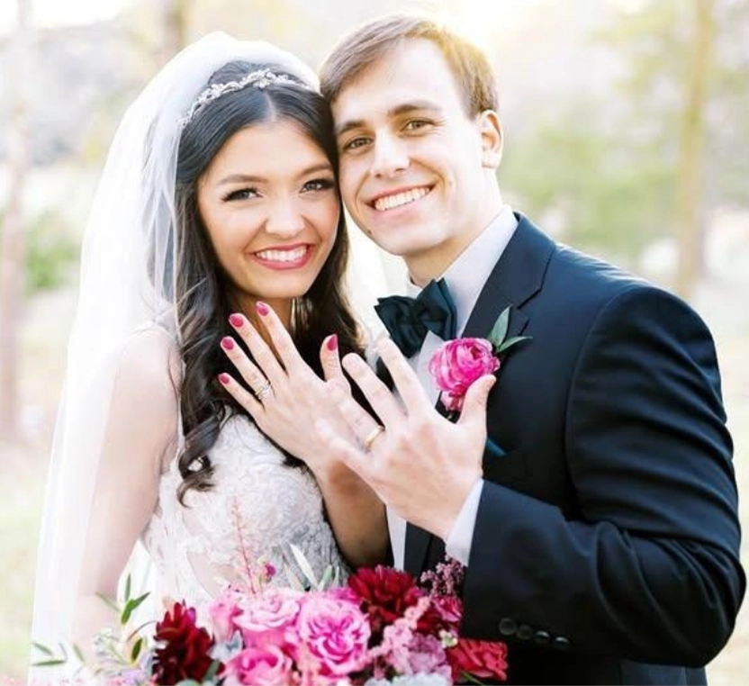 Couple on their wedding day with a blurred natural background